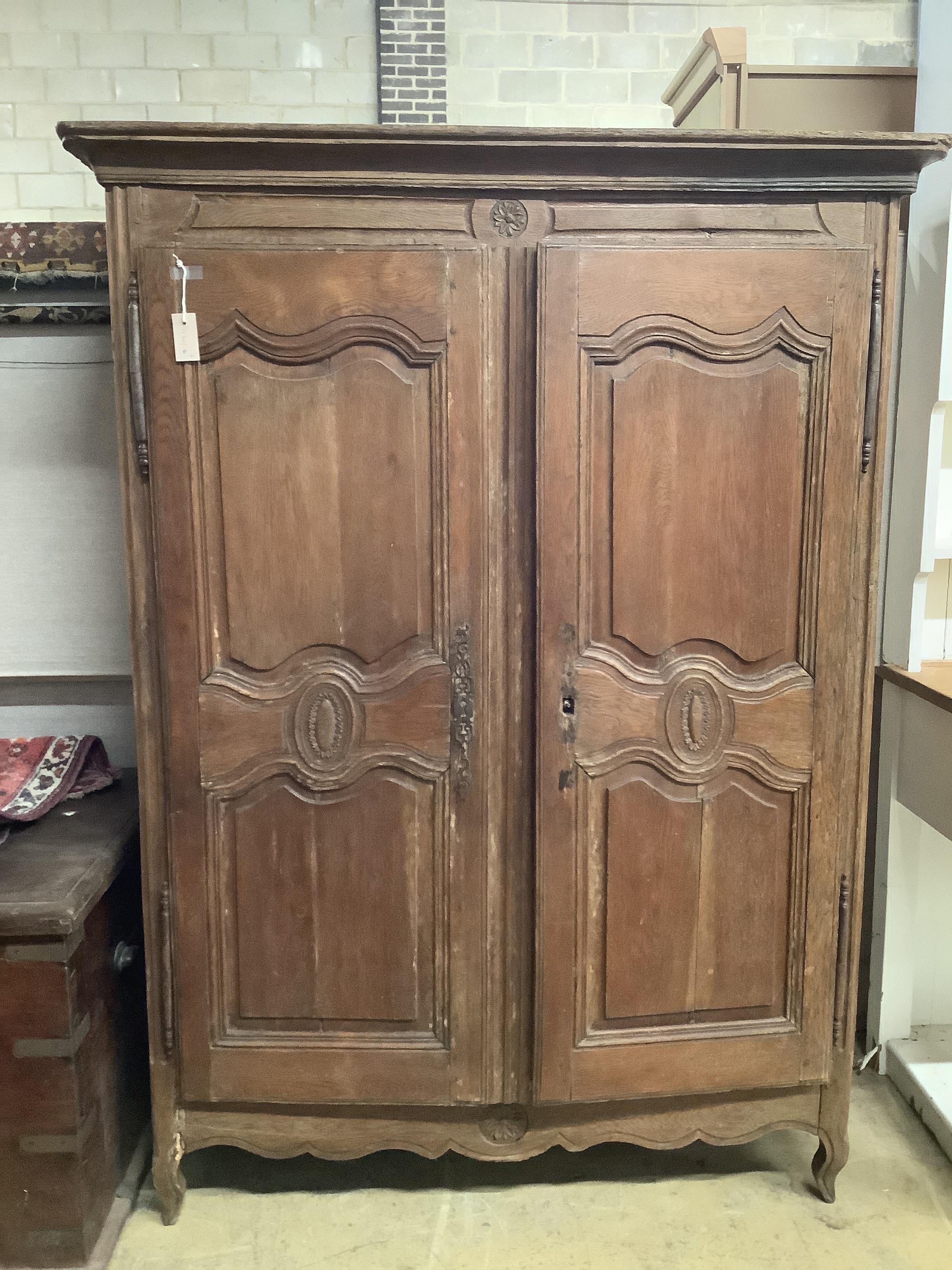 A late 18th / early 19th century French oak armoire, width 134cm, depth 56cm, height 184cm